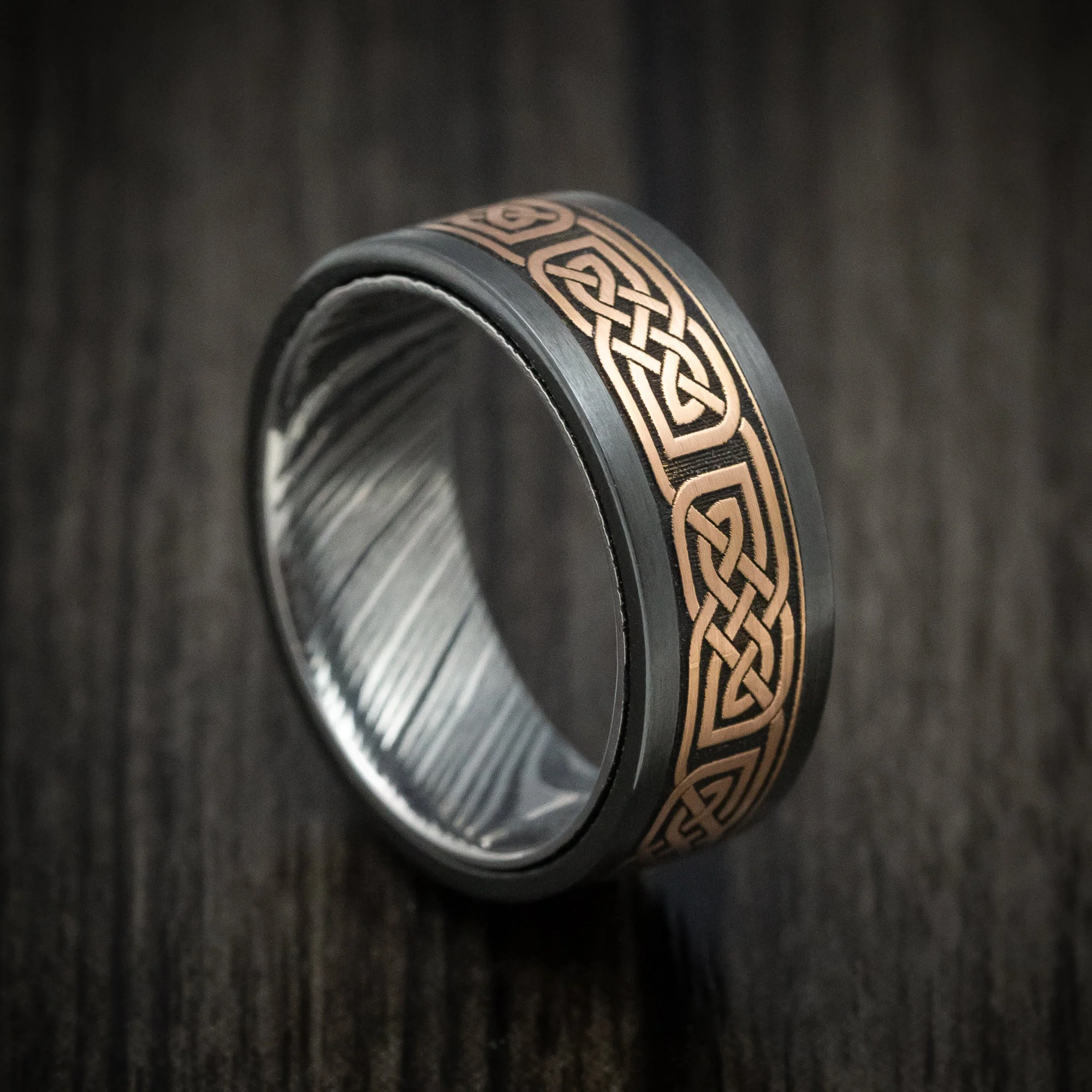 Black Titanium and Woodgrain Kuro Damascus Steel 14K Gold Celtic Knot Pattern Inlay Men's Ring