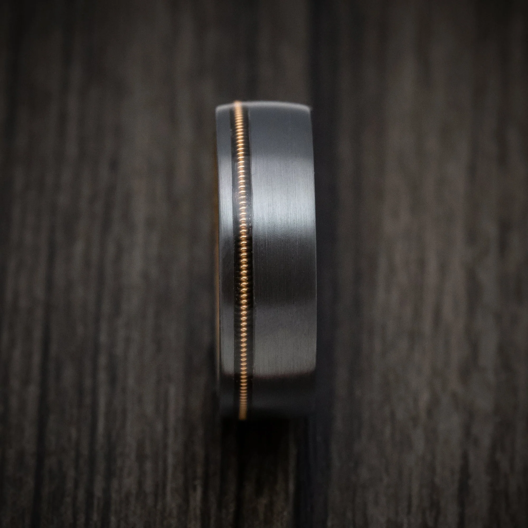 Black Titanium or Black Zirconium Custom Men's Ring with Guitar String Inlay and Whiskey Barrel Hardwood Sleeve - Image 3