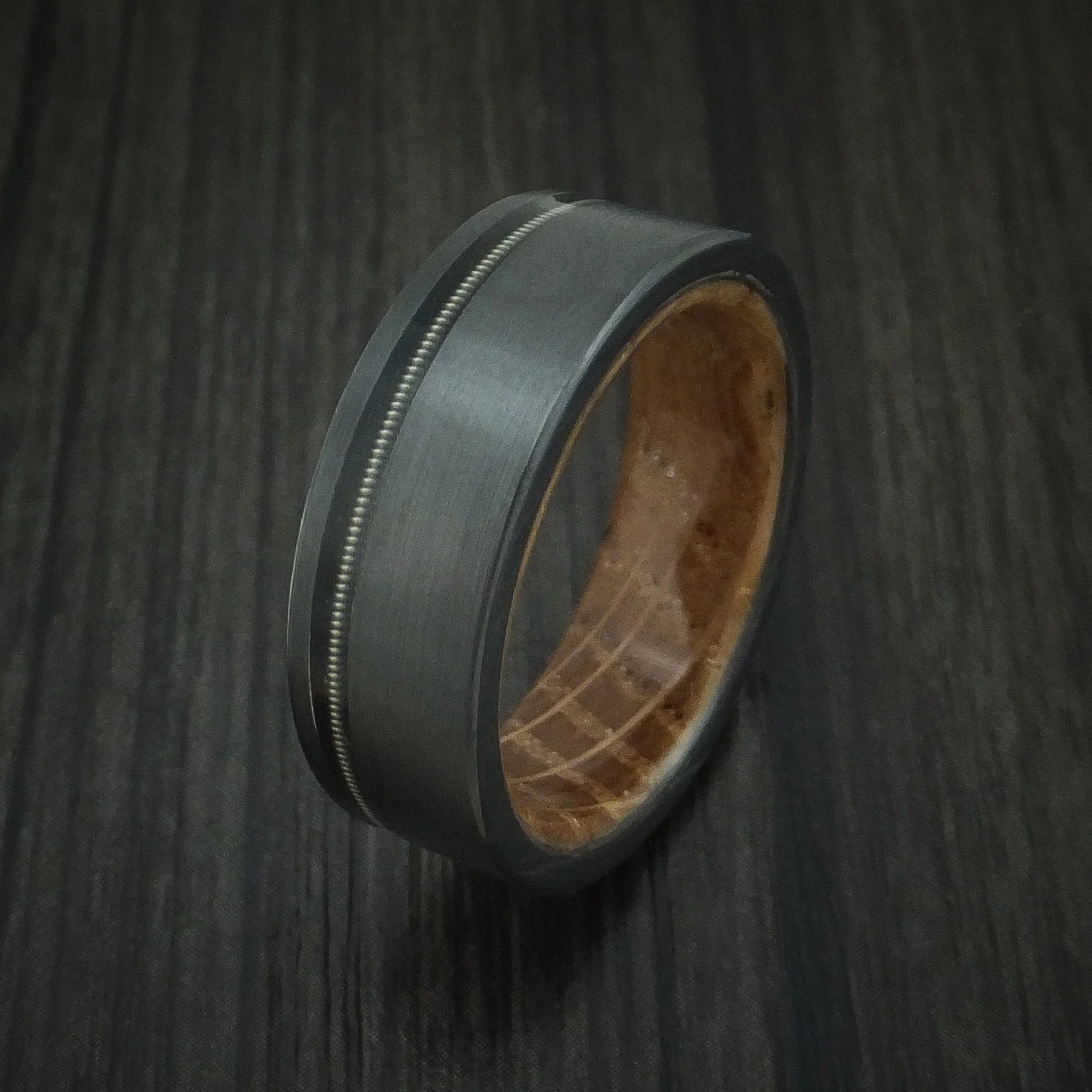 Black Titanium or Black Zirconium Custom Men's Ring with a Guitar String Inlay and Whiskey Barrel Hardwood Sleeve - Image 4