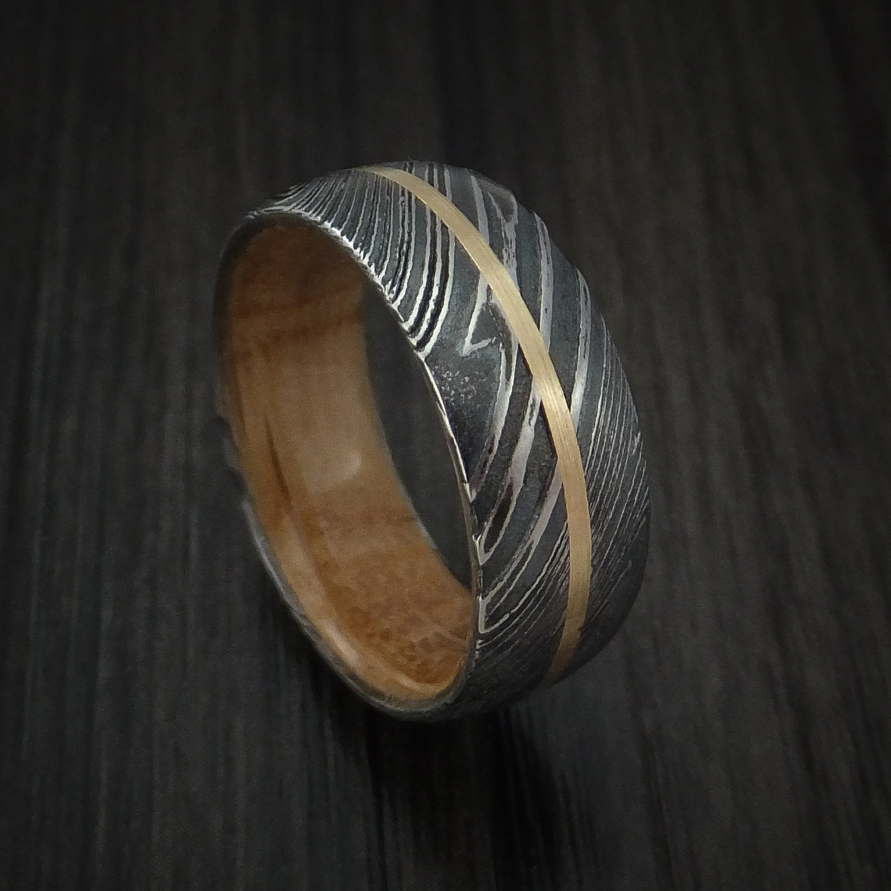 Woodgrain Kuro Damascus Steel Men's Ring with 14K Yellow Gold Inlay and Whiskey Barrel Wood Hardwood Sleeve Custom Made Wood Band